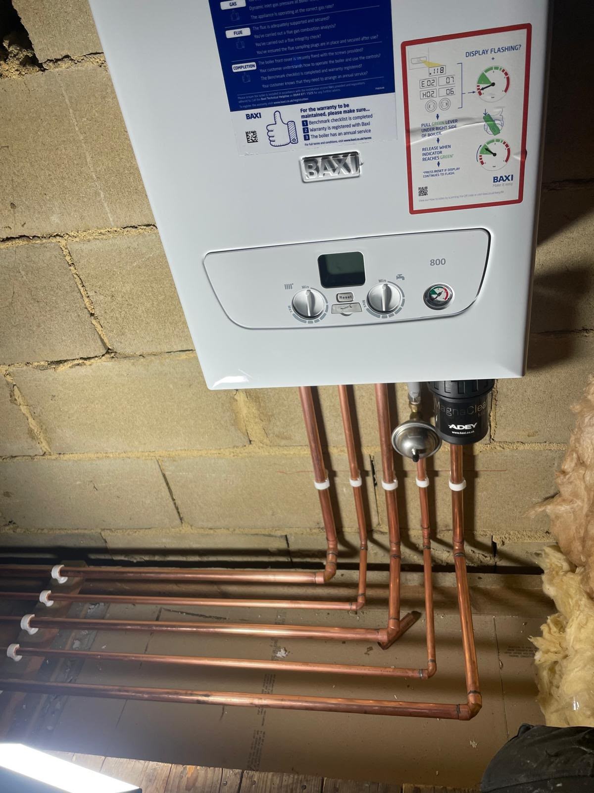 Boiler installation showing gas supply, filling loop and system filter neatly fitted