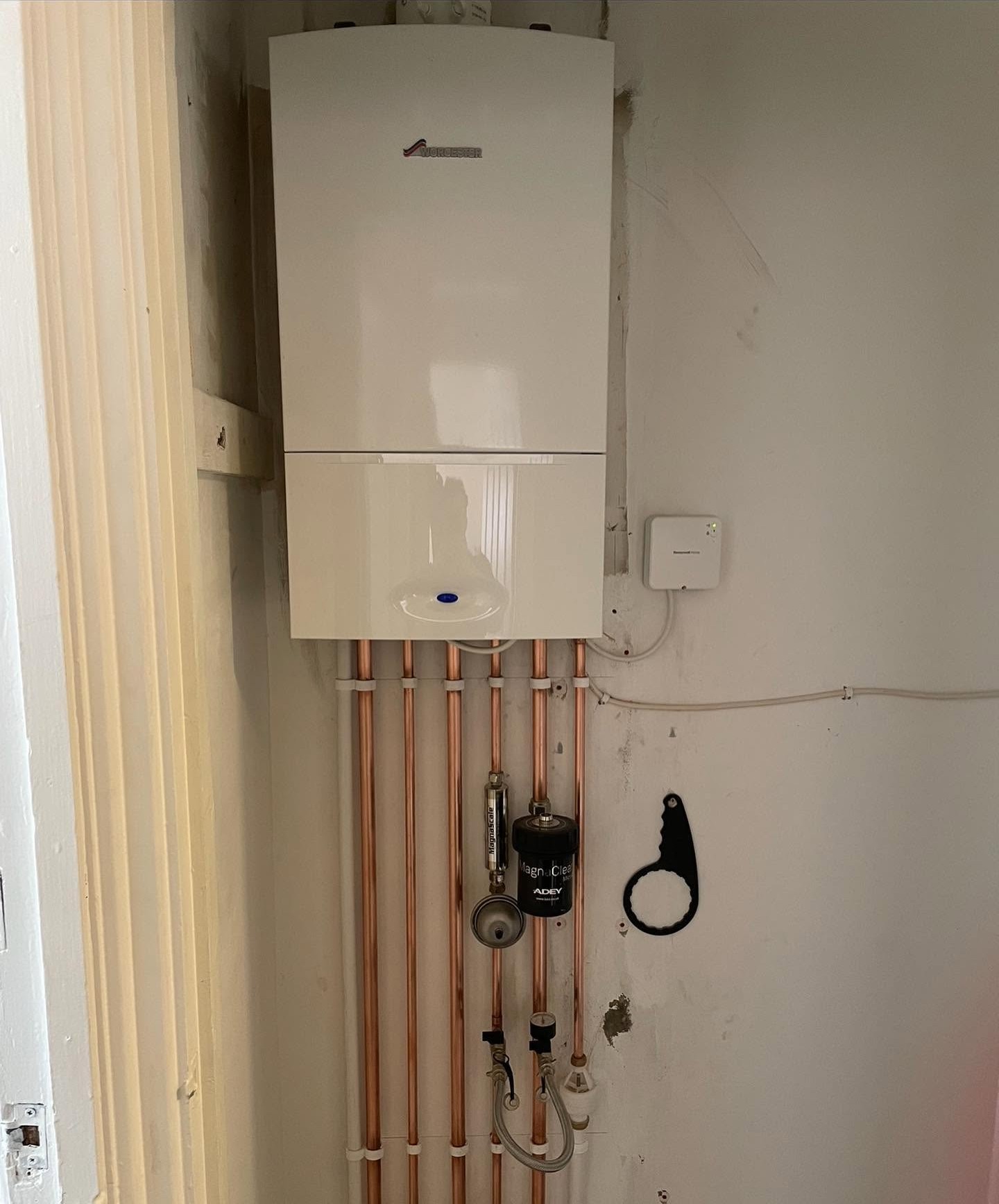 Completed boiler installation with tidy pipework and clean finish