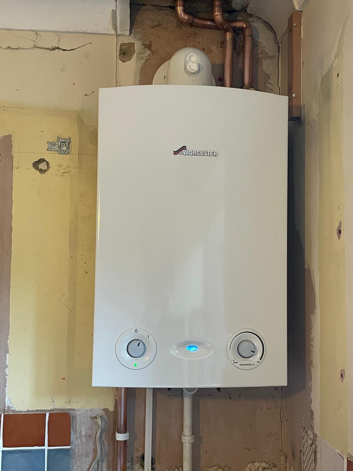 Wall-mounted gas boiler with tidy copper pipework after a boiler installation in north Hampshire