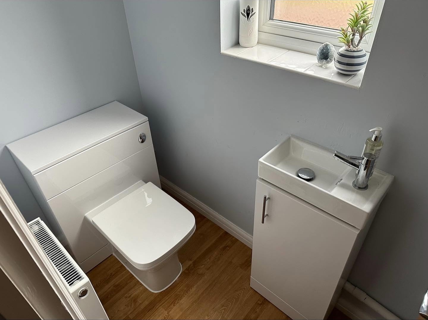 Cloakroom toilet and compact vanity basin plumbed in and finished