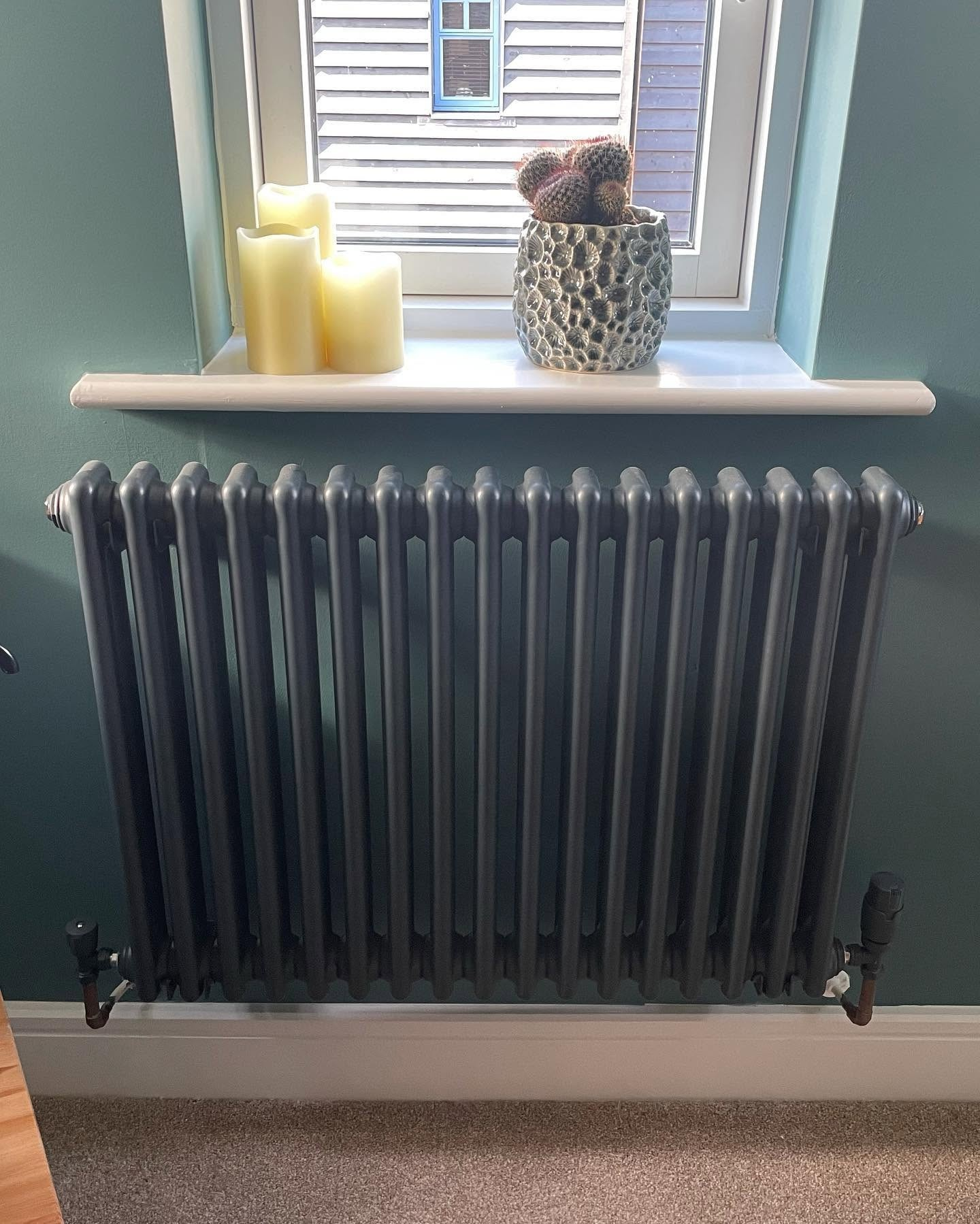 Column radiator fitted as part of a central heating installation in Basingstoke