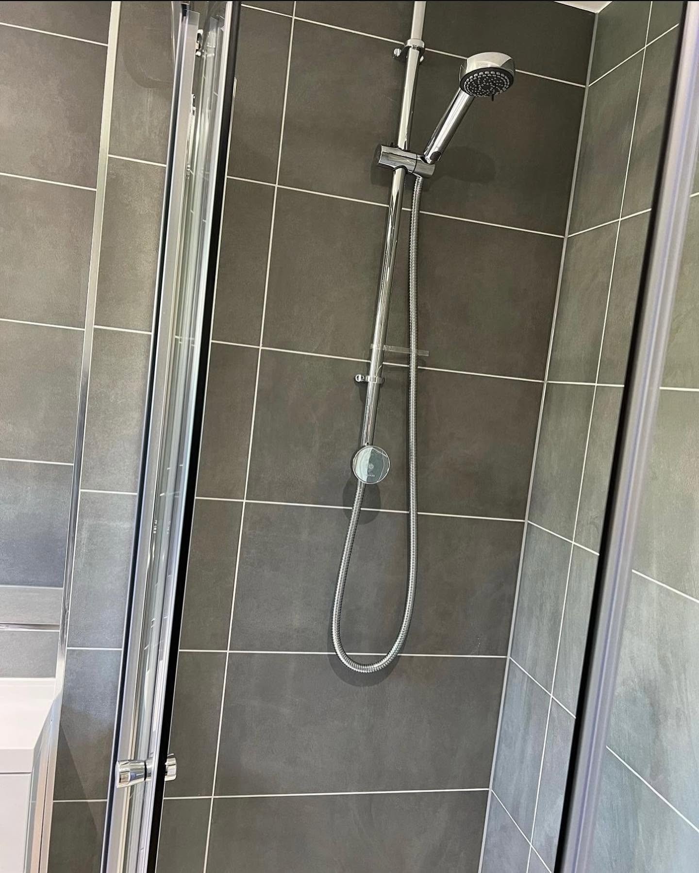 New shower installation completed as part of bathroom plumbing work