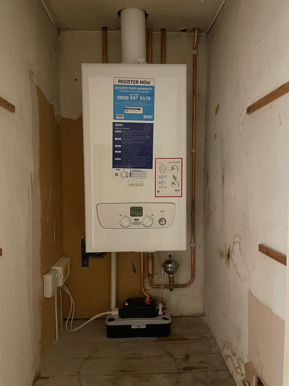 New condensing combi boiler fitted in a kitchen cupboard by SFB Heating and Cooling